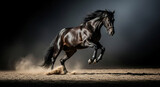 A dark, powerful horse leaps forward, kicking up dust in a dramatic, dynamic pose against a dark background.