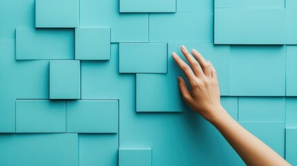 Aufkleber - Elegant hand touching a modern blue geometric wall art installation