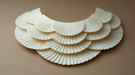 Fototapete - Set of layered chokers arranged in a fan shape on neutral surface with layout area
