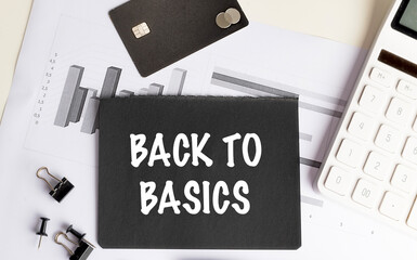 Poster - Back to basics message on black card with financial charts, credit card, calculator and stationery