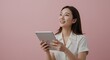 © 9BEi - Happy Asian Woman Using Tablet, Smiling and Looking Up