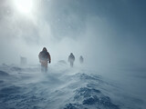Explorers hiking through arctic blizzard in snowy landscape