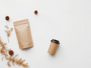 Poster - Autumnal Flat Lay with Coffee Cup, Sealed Paper Pouch, and Natural Botanical Elements on a Clean White Surface
