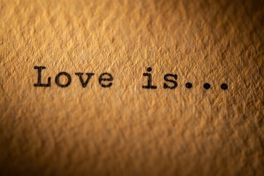Love is, the inscription on a typewriter.