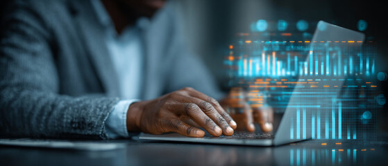 Poster - Man typing on a laptop with data visualization overlay in the foreground