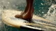 © BaniMakrufah - Surfer's foot on a board in the ocean's waves