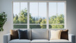 © LIVING SPACE - modern living room features cozy sofa with decorative cushions, framed by large windows that offer view of lush greenery and distant mountains. natural light creates warm ambiance