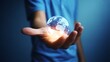 © REZAUL - Hand holding glowing digital globe with continents and light effects earth world