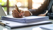© HumblePride - Business document in writing: A close-up perspective of a professional engrossed in the act of meticulous writing on official documentation.