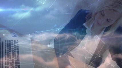 Poster - Businesswoman tapping tablet stylus reviewing documents entering data on laptop with cloud overlay