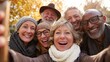 © Harry - Cheerful older friends enjoy autumnal selfie, capturing joyful moment and celebrating friendship in a vibrant outdoor park setting.