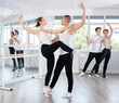 © JackF - Young man and young woman perform paired ballet dance in studio