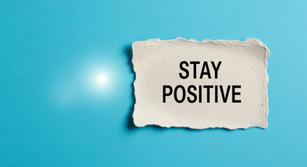 Poster - Torn paper with Stay Positive text on blue background