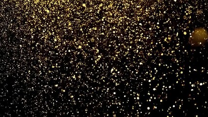 Poster - Abstract golden explosion with small particles illuminating a dark background, resembling dust or liquid drops with lens flare and bokeh