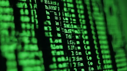Poster - Close-Up Green Computer Code Displayed On Dark Screen Background For Software Development and Cybersecurity