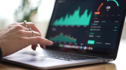 Poster - Hands Typing on Laptop Keyboard Displaying Financial Charts for Business Analysis and Data Driven Insights Focused View