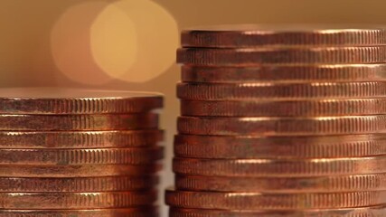 Poster - Macro Shot of Stacked Copper Coins with Golden Bokeh Background Finance Growth and Wealth Concept