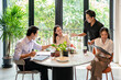 © Fahng - Group of Young Business People on Break in Office. Successful Business Team Talking on Coffee Break. Young Smiling Colleagues on Break Drinking Coffee Chatting in Modern Office. Corporate Lifestyle.
