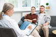 © New Africa - In vitro fertilization (IVF). Couple having consultation with doctor in reproductive clinic, selective focus