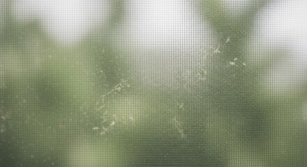 A dirty screen texture with blurred green background