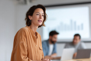 Poster - Confident woman presenting charts. Perfect for corporate, leadership, training, or business concepts. Teamwork and successful strategy metaphors.