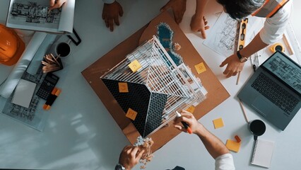 Poster - time lapse of smart architect engineer team inspect house model while project manager hold blueprint