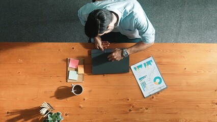 Poster - Male leader in casual cloth using phone to call manager while walking at meeting table. Professional businessman talking or discussing with smart manager about business plan or strategy. Convocation.