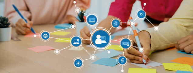 Poster - A vibrant office scene capturing teamwork and collaboration with sticky notes and digital tools. Ideal for showcasing creativity and productive interactions in a professional setting. Amity