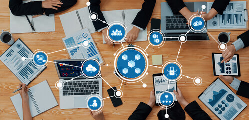 Poster - Business professionals collaborate in a modern workspace, utilizing digital tools for data analysis and strategic planning amidst various presentations and reports. Amity