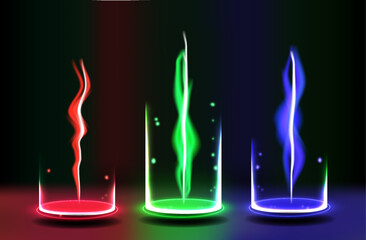 Poster - Three glass cylinders display vibrant light trails of red, green, and blue amidst a dark backdrop, creating an intriguing visual effect at night