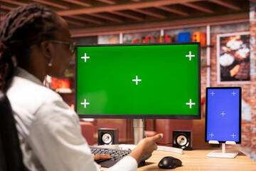 Poster - student at home browsing internet on green screen computer and tablet, doing homework. girl in apart