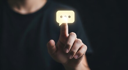 Poster - Person touching a glowing message icon with their finger against a dark blurred background image view