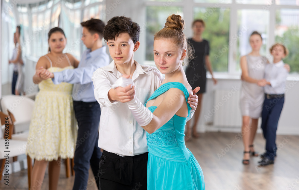 Emotional adolescent ballroom dancers, girls and boys in formal wear ...