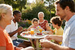 © HOT PLACE - Multicultural Family Having Breakfast Outdoors