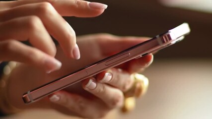 Poster - Female Hands Using Rose Gold Mobile Phone with Manicured Nails and Gold Ring