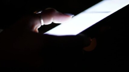 Poster - Glowing Smartphone Screen Held in Hand Against Dark Backdrop with Bokeh Lights