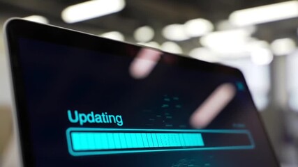 Poster - Laptop Screen Showing Blue Updating Bar with Blurred Background Indicating System Software Installation Progress and