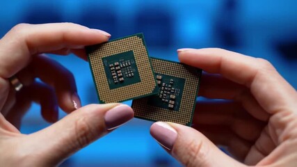 Poster - Two Computer Processors Held Between Fingers with Pink Polish and Blue Background