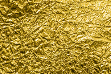 Wall Mural - luxury shiny metallic golden foil crumpled texture background