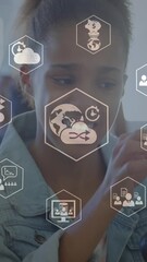 Poster - Animation of digital icons spinning over two diverse girls discussing over a car model at school