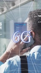 Poster - Animation of data processing against rear view of a man talking on smartphone at office