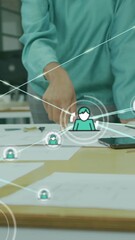 Poster - Animation of connected icons over diverse coworkers discussing reports in office