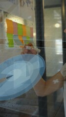 Poster - Woman writing on transparent board with futuristic data processing animation overlay