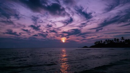 Wall Mural - panoramic sunset over a tropical island the sea stretching into the horizon under an orange sky with clouds timelapse capturing the dreamy essence of summer beach life and tranquil seaside