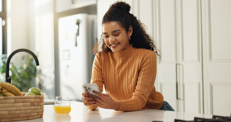 Home, smile and woman in kitchen, smartphone and typing with social media, connection and texting. Apartment, orange juice and cellphone with communication, internet and message to contact and email