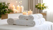 © Zatra - White Towels and Lit Candles on Massage Table