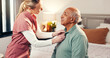 © peopleimages.com - Nurse, help and clothes with old man in bedroom for dressing, advice and support. Getting ready, morning routine and healthcare with caregiver and patient in nursing home for retirement and trust