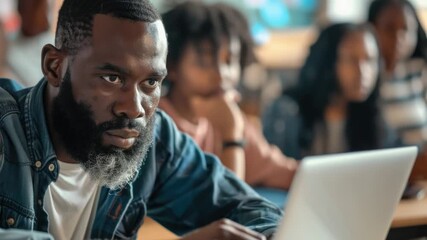 Leinwandbilder - A person sitting in front of a laptop computer, possibly working or browsing