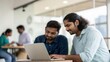 © N7 - Portrait of Indian Colleagues Sharing Digital Report in Cloud Workspace
