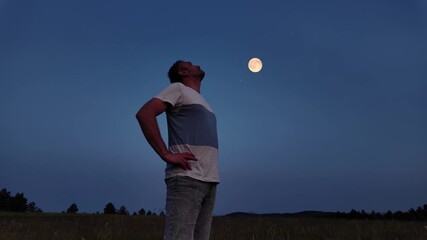 Wall Mural - amateur astronomer watching stars, moon, planets and other celestial objects from a field in nature.